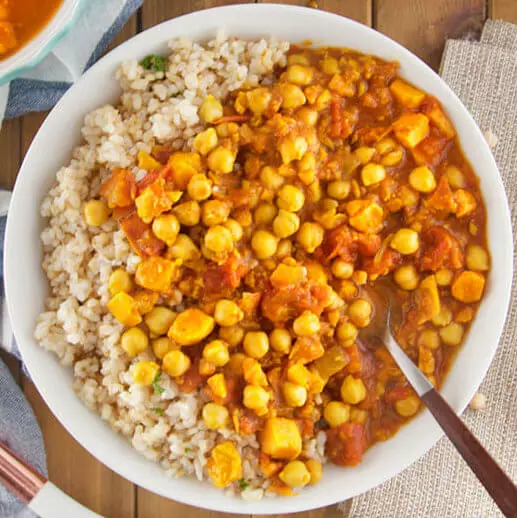 Spicy Indian Chana Masala with Sweet Potatoes Over Herbed Brown Rice