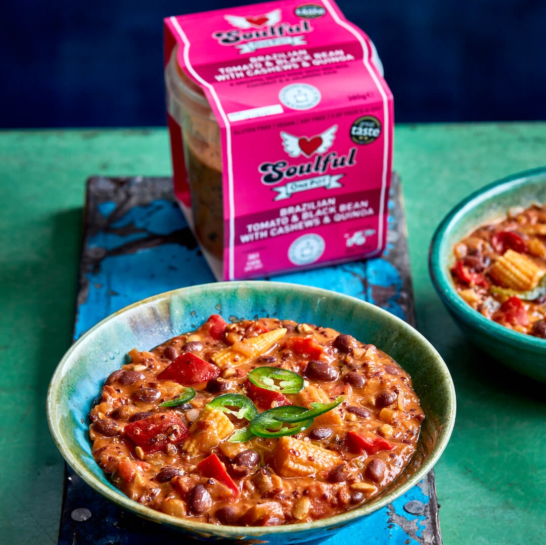 Brazilian Tomato & Black Bean. A smooth, nutty stew with red rice, coconut &amp; a jalapeño kick.